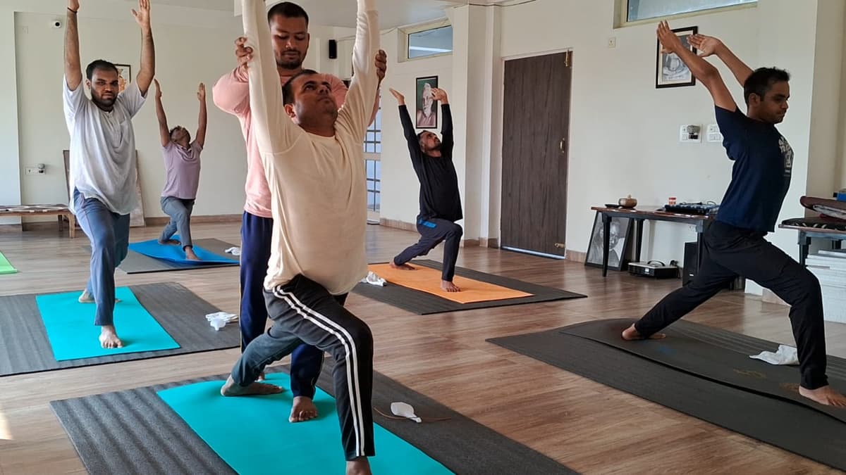 Hands-on yoga alignment instruction at Light House